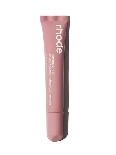 Pink lip balm tube with 'rhode' branding on a white background