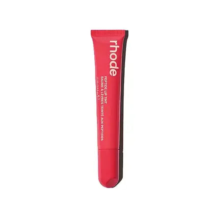 Red lip balm tube with 'rhode' branding on a white background