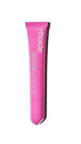 Pink lip balm tube with 'rhode' branding on a white background